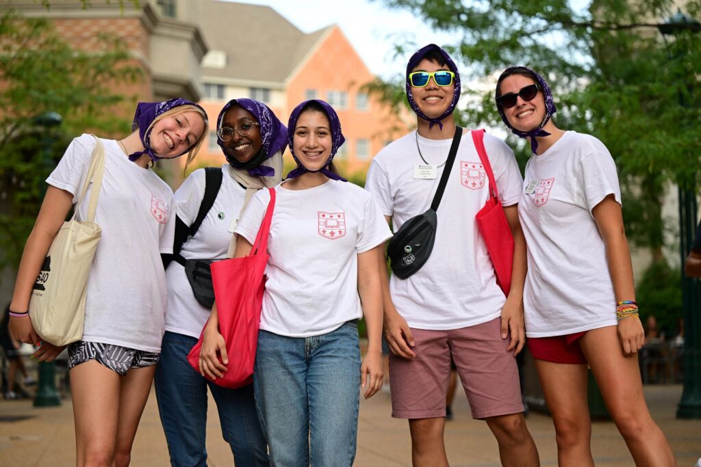 Smiling students pose together during Convocation
